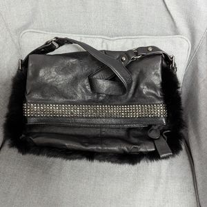 Leather purse with faux fur trim and rhinestone detail